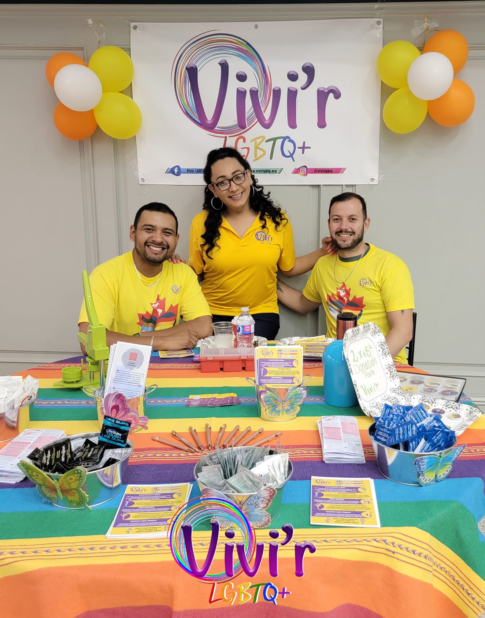 Three team members at a community booth