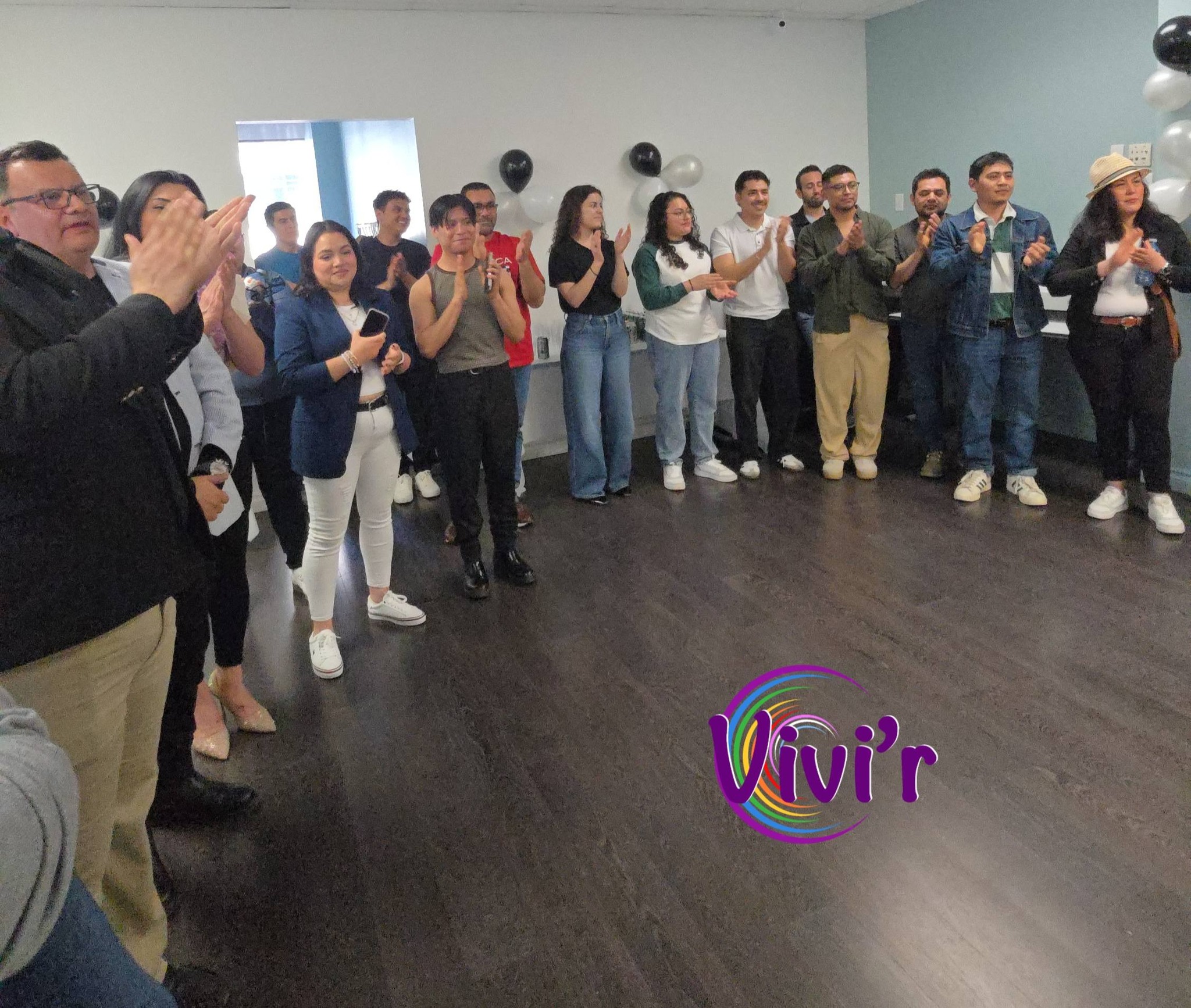 Community members applauding at a celebration