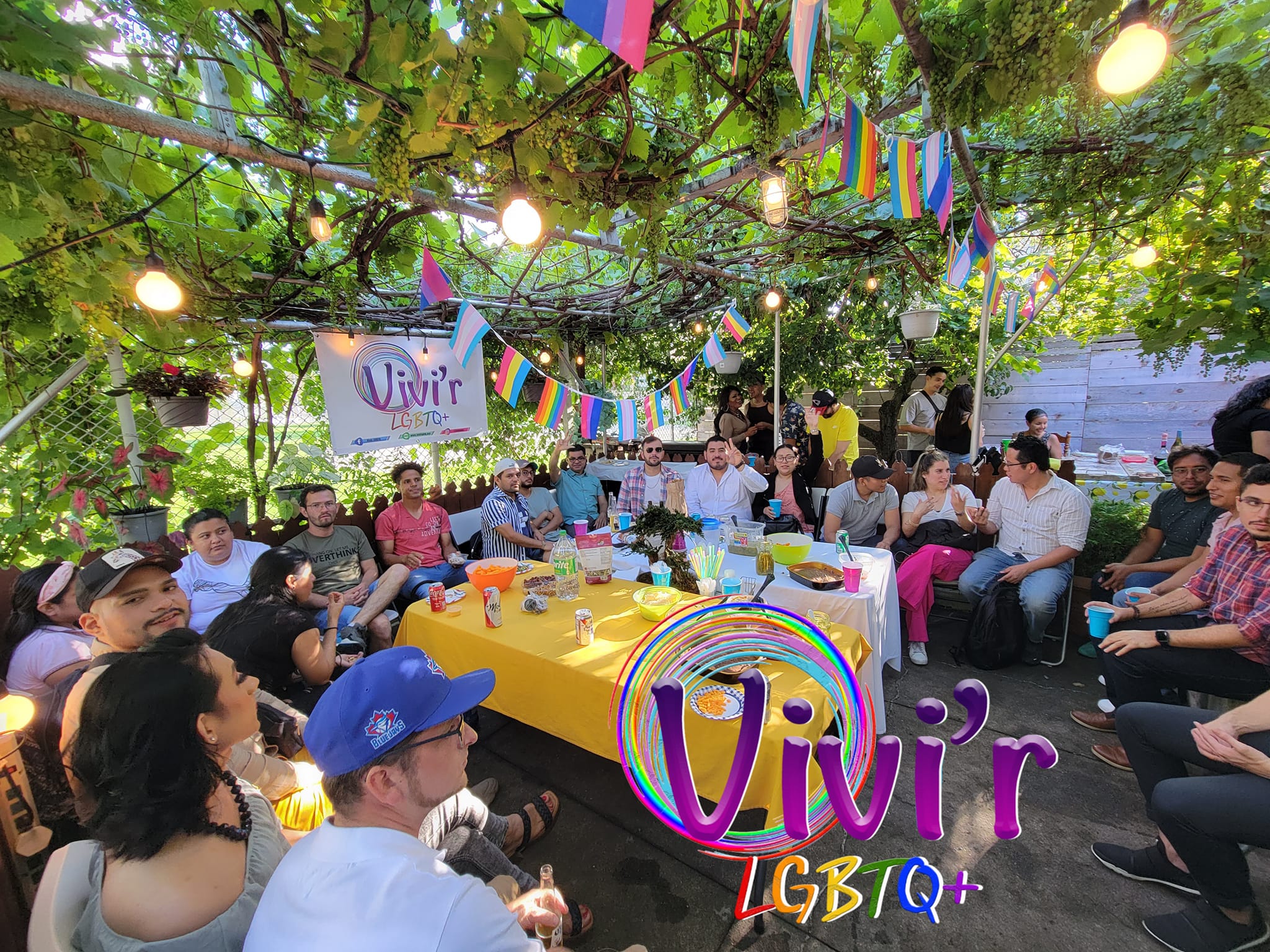 Garden gathering with rainbow flags