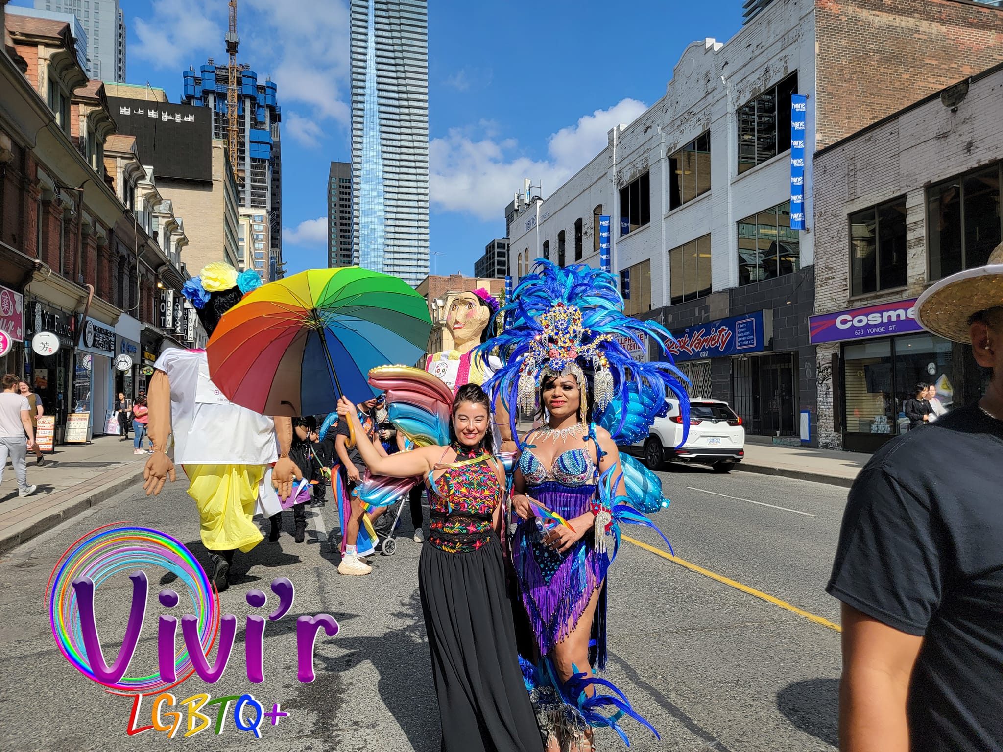 Pride parade dancers in butterfly costumes