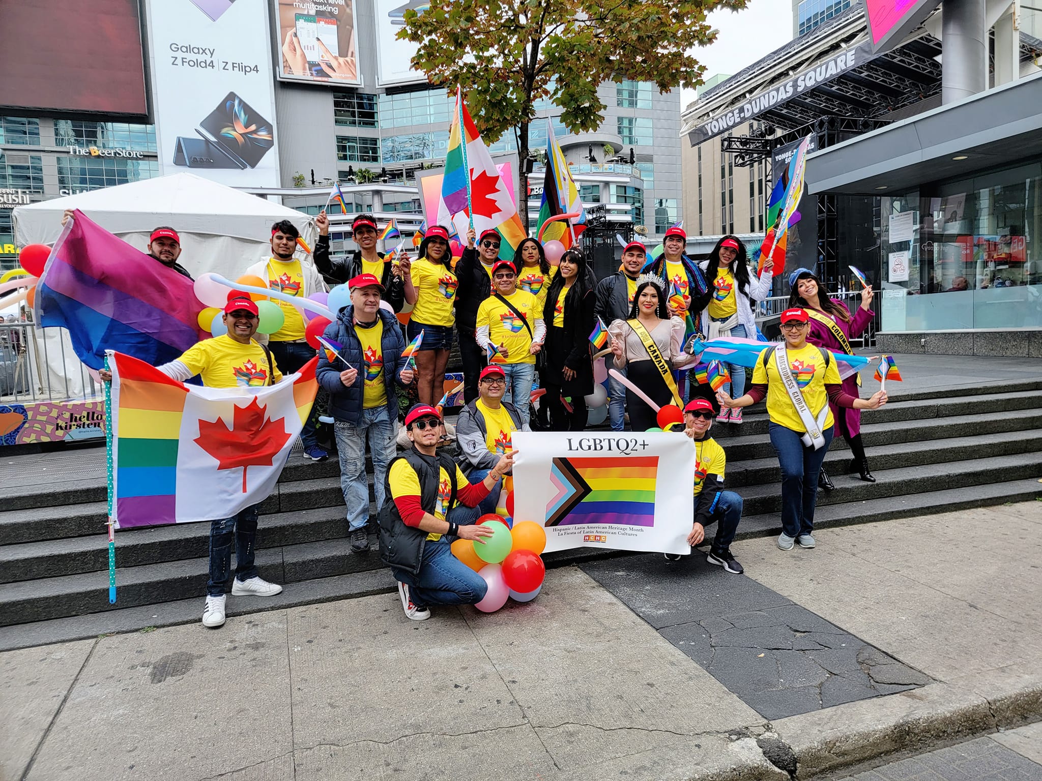 VIVI'R LGBTQ+ team with yellow shirts and banner