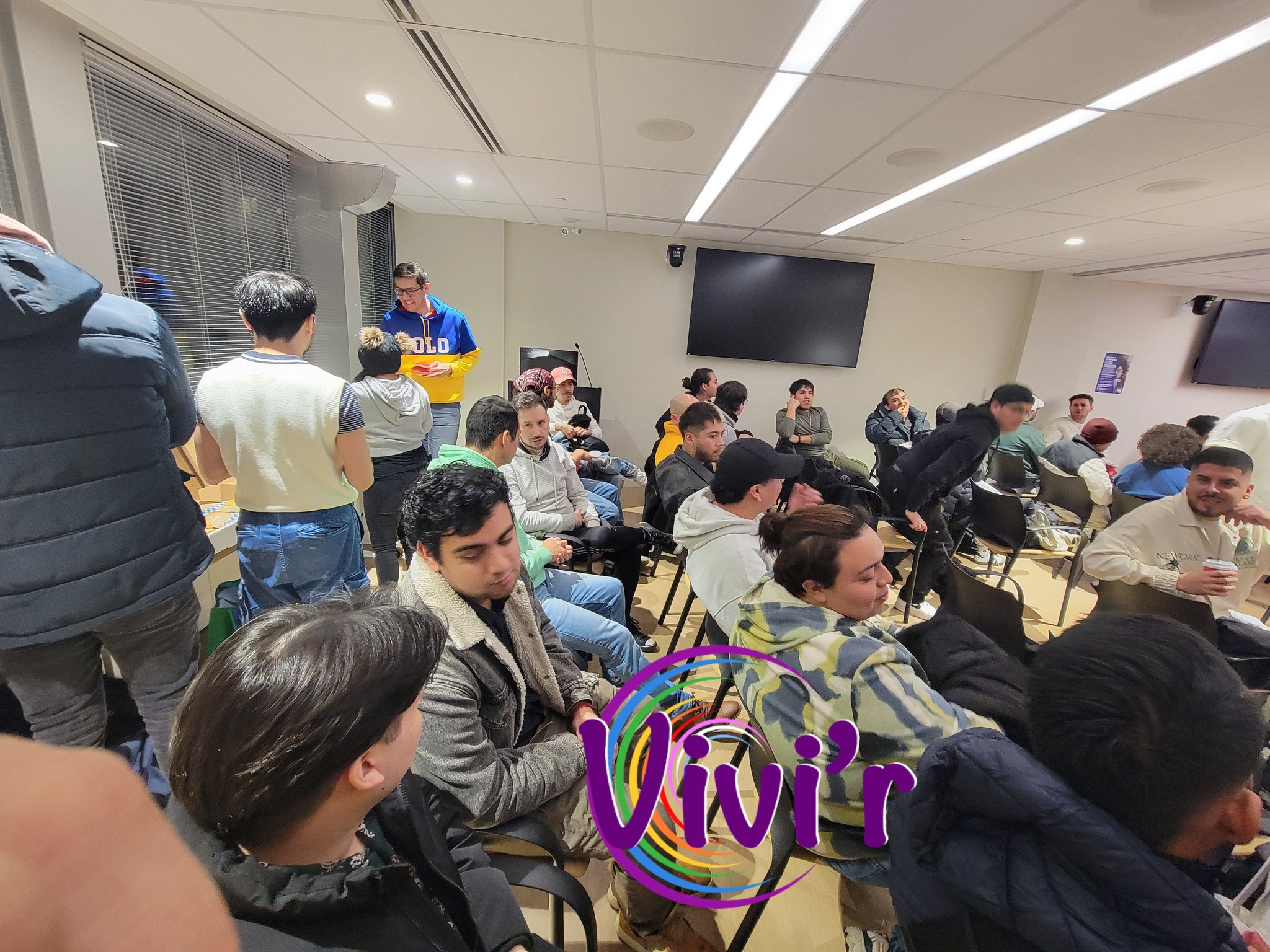 Speaker presenting to a seated community group