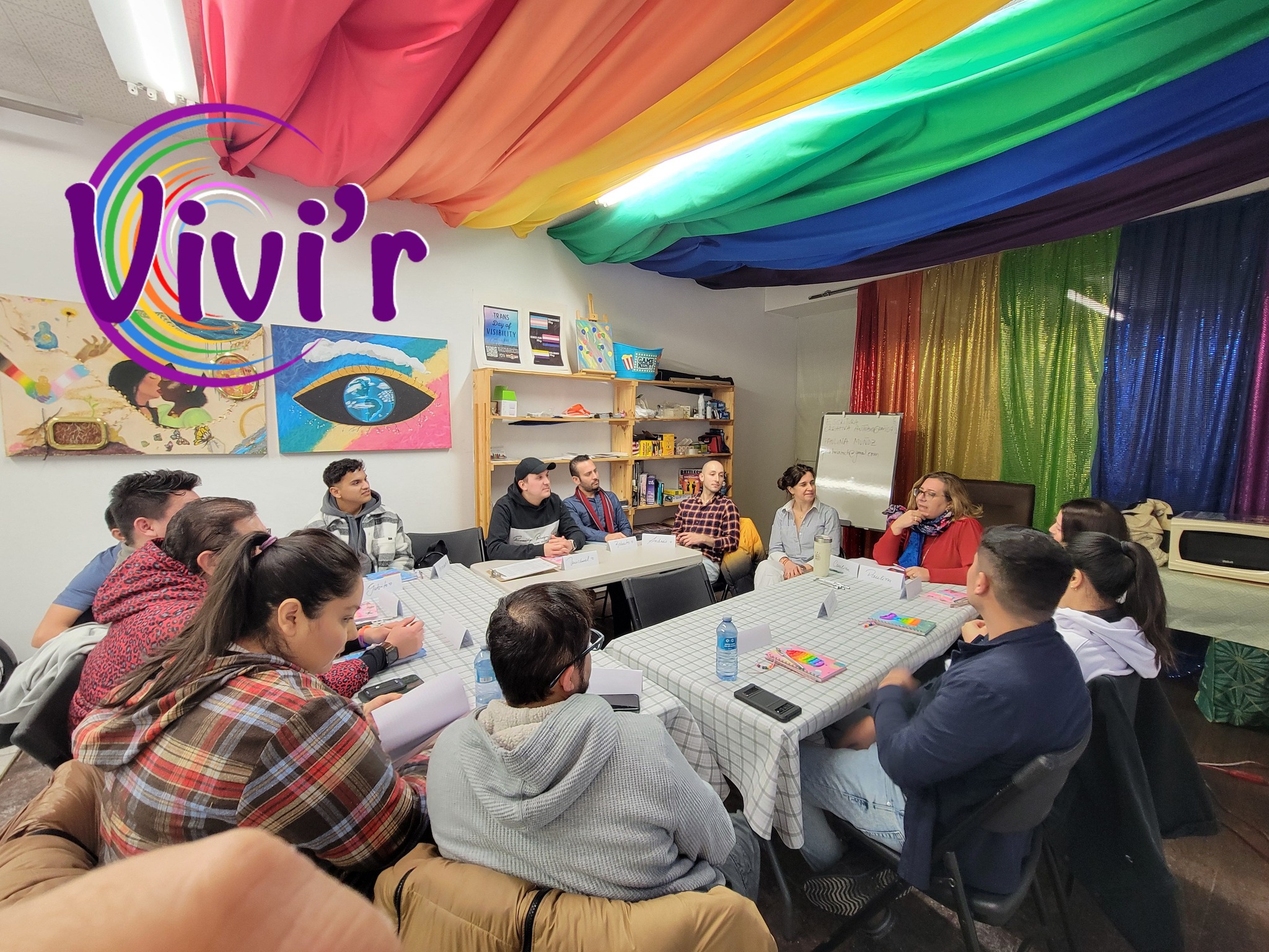 Workshop under the rainbow flag canopy